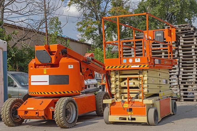 forklift moving crates in a large warehouse in Alorton